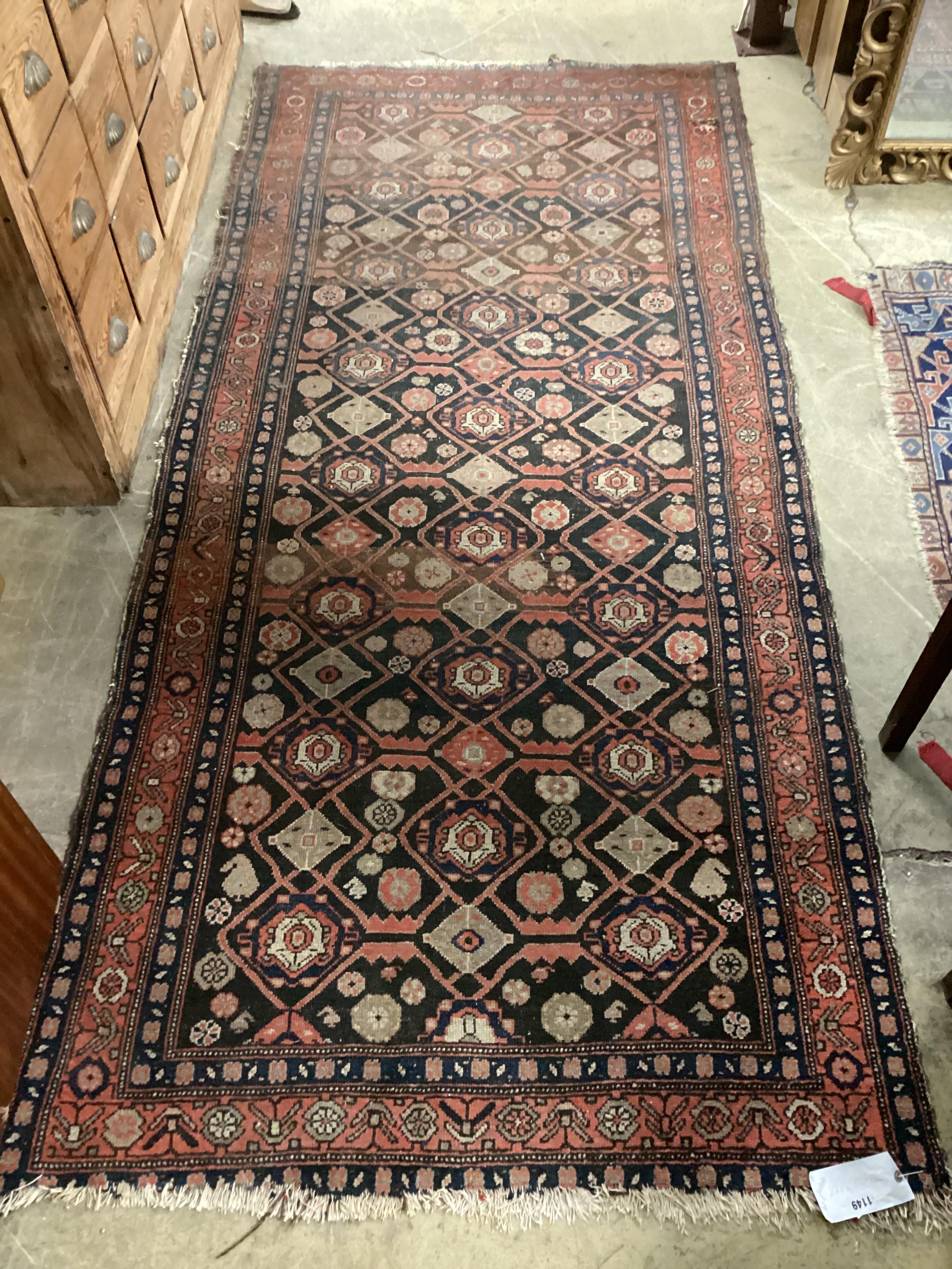 An antique Hamadan blue ground rug 270cm x 120cm